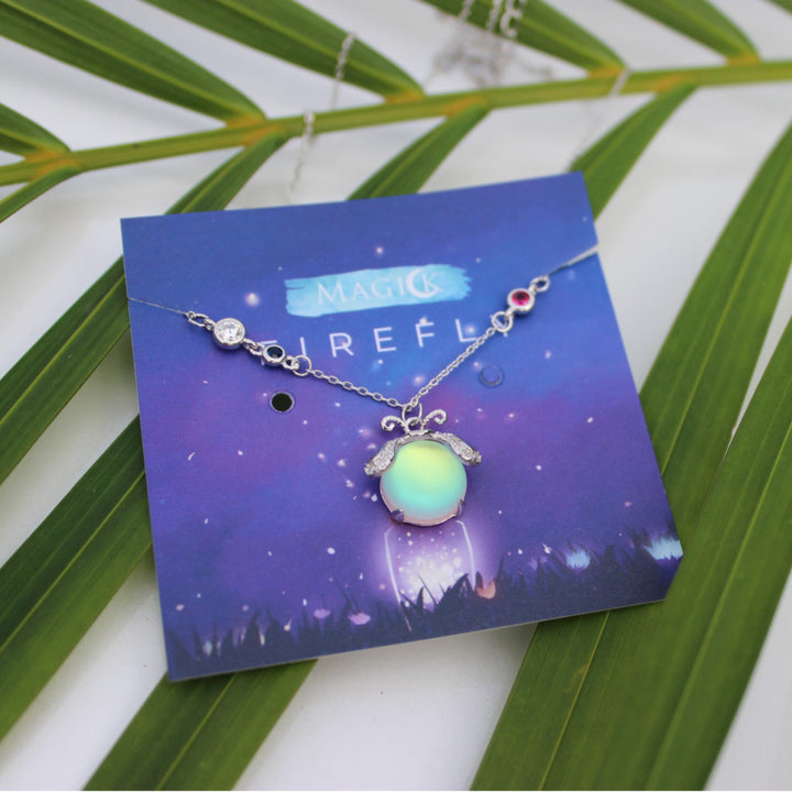 Iridescent moonstone and delicate silver firefly pendant, enchanting women's necklace jewelry.