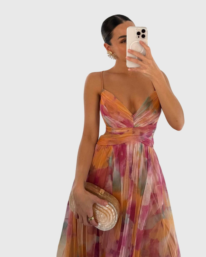 Elegant floral maxi dress for women, featuring a vibrant print, flowy fabric, ideal for spring parties.
