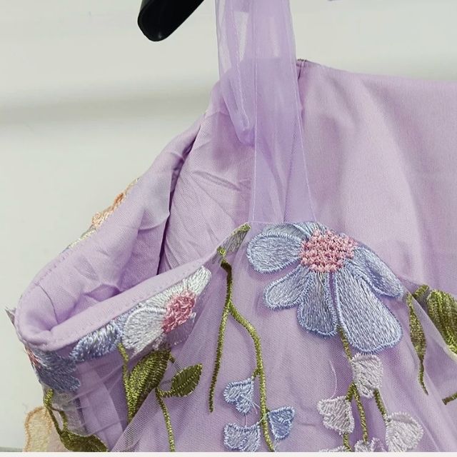 Elegant women's formal party dress. Tulle material with stunning floral appliqué details.