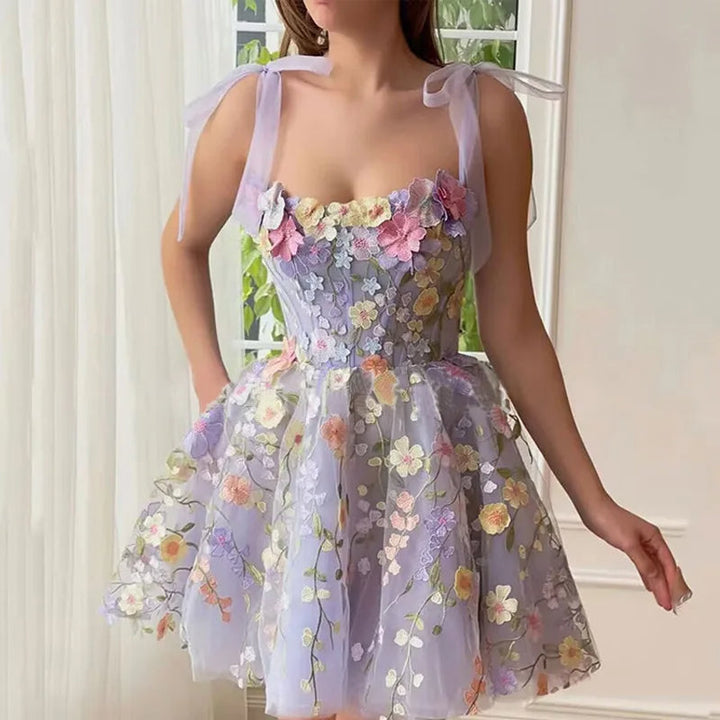 Beautiful Rosalie tulle evening gown with enchanting floral details. Perfect for women's special occasions.