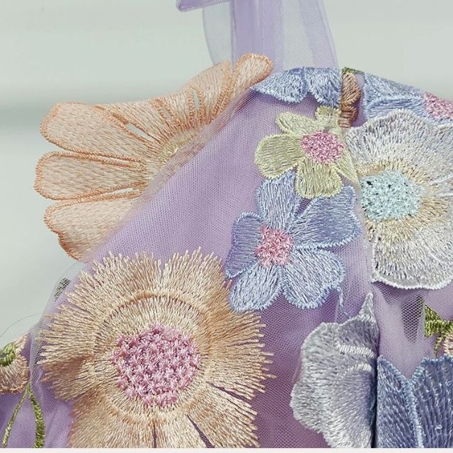 Gorgeous women's flared tulle dress with intricate floral appliqués. Elegant evening wear.