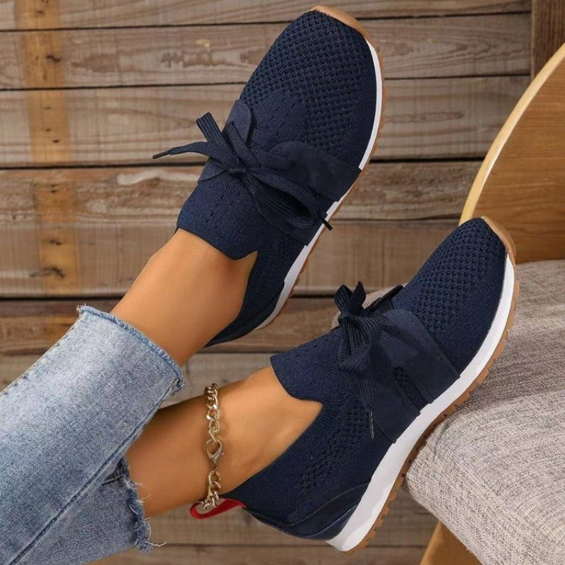 Athletic women's orthopedic sneakers, offering ergonomic foot support and all-day comfort for casual & active wear.