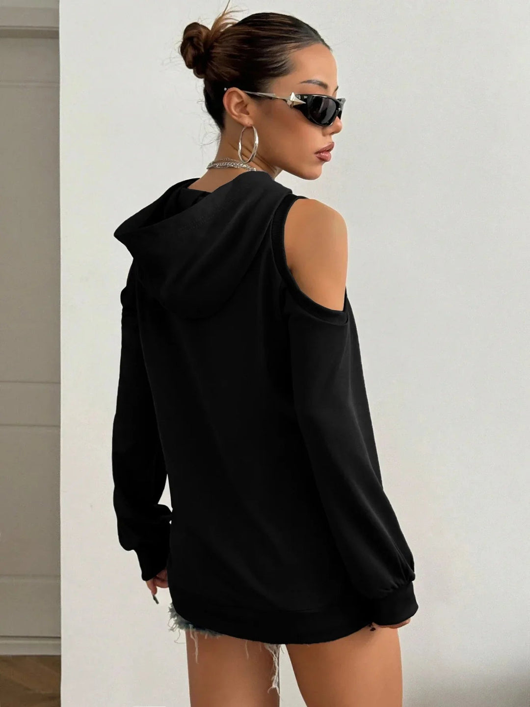 Stylish off-shoulder hoodie for women, a soft long sleeve top for casual elegance & relaxed comfort.