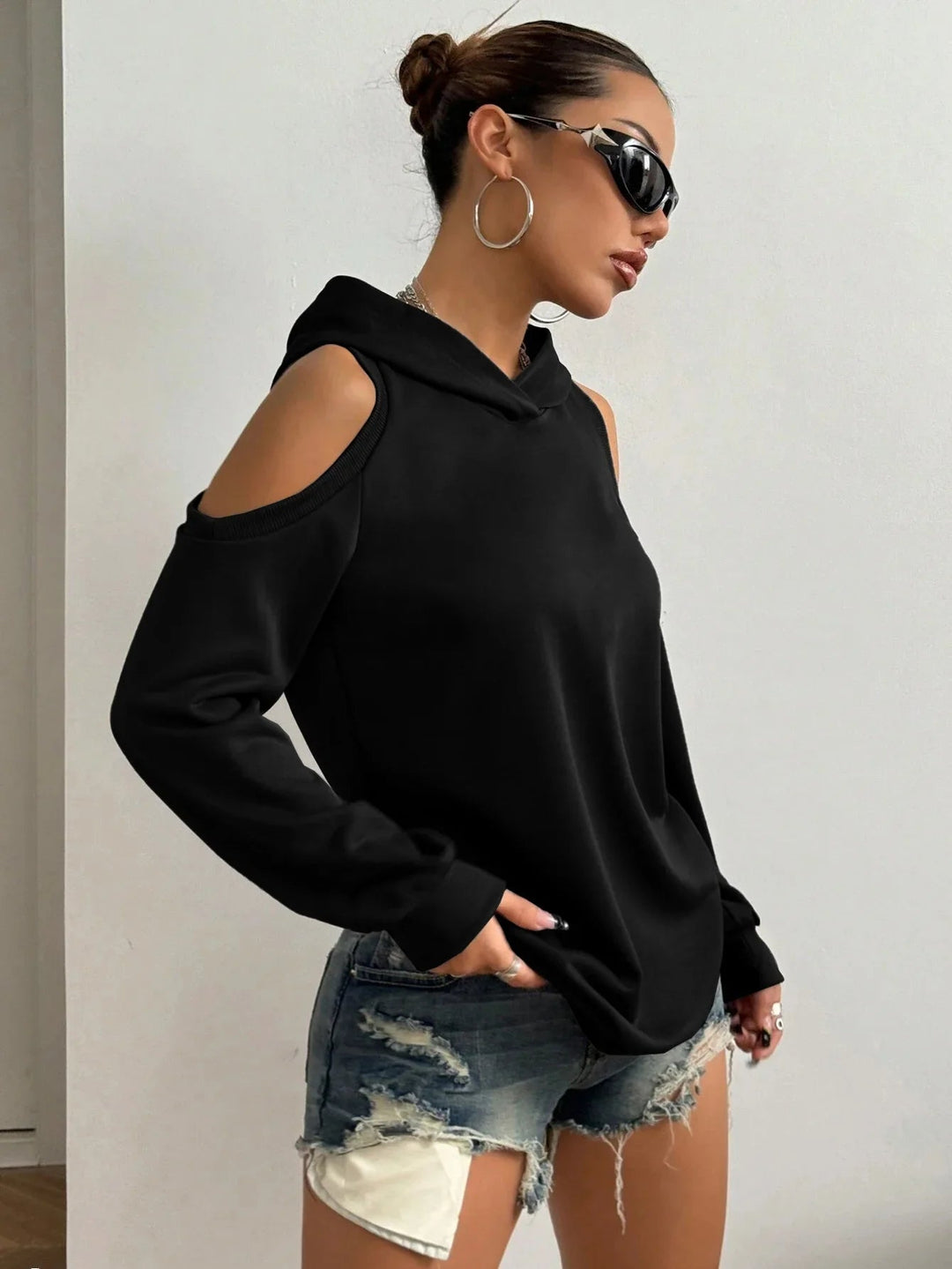 Women's Essentia off-shoulder long sleeve hoodie, an essential layering piece for casual, comfortable outfits.