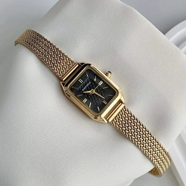 Close-up of Estella women's elegant wristwatch dial, showcasing minimalist and petite design.