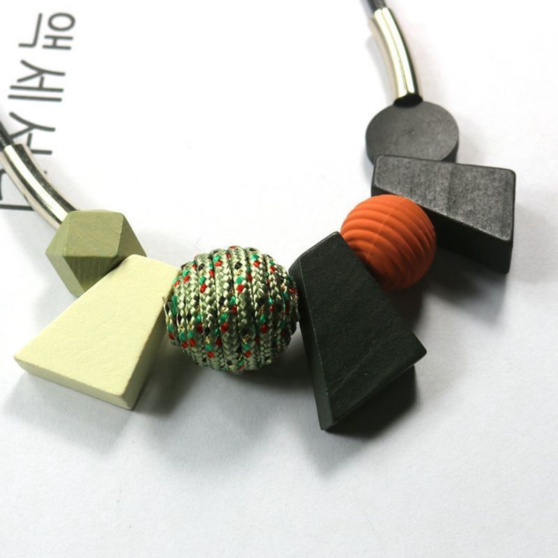 Statement women's ethnic geometric wooden bead necklace. Handmade natural wood jewelry for boho fashion.