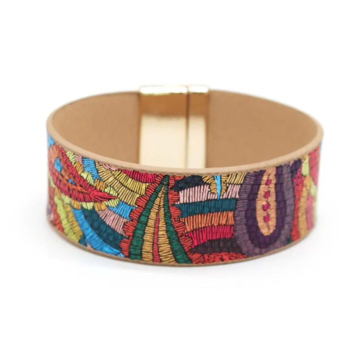 Women's ethnic leather wrap bracelet in vibrant red & green, unique boho chic fashion accessory.