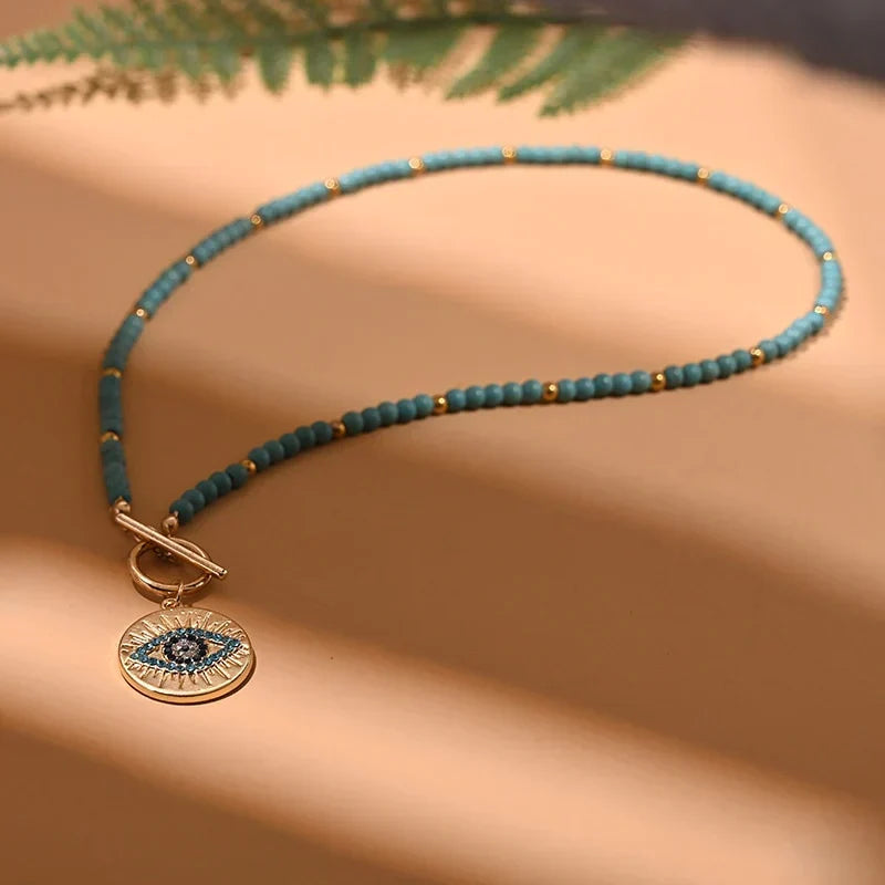 Elegant women's evil eye pearl choker necklace, a stylish accessory providing spiritual protection.