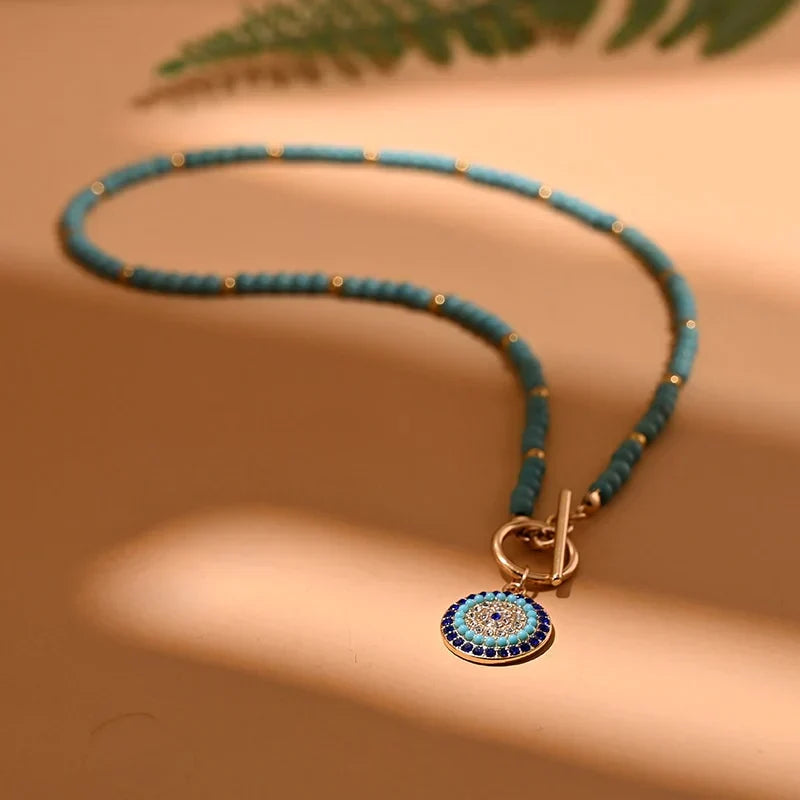 Dainty women's evil eye and pearl choker necklace, a chic fashion accessory for modern women.