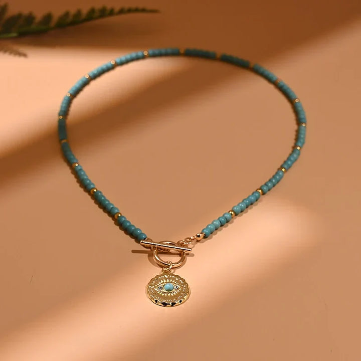 Spiritual evil eye pearl choker necklace for women, offering protection, style, and good fortune.