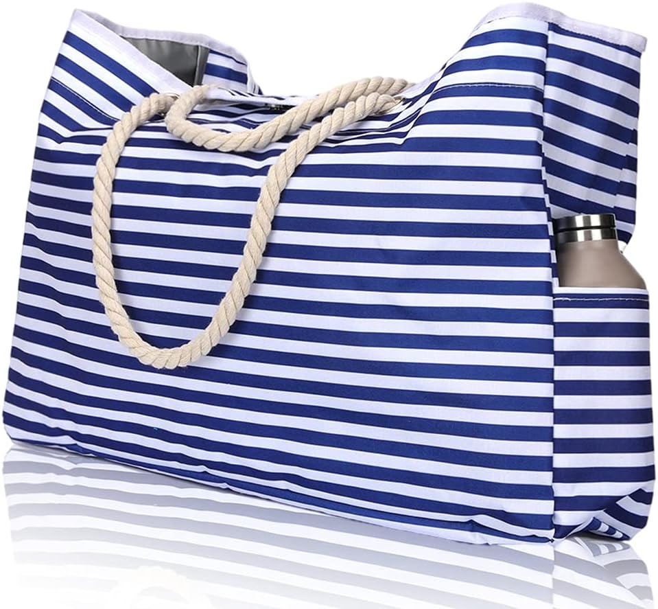 Large striped waterproof beach tote, designed for women. Features sandproof material & convenient bonus pouch.