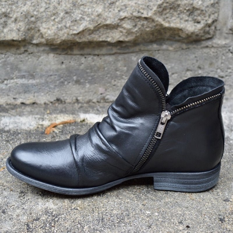 Elegant women's ankle boots, chic design with a functional zipper. Ideal fashionable footwear for winter.
