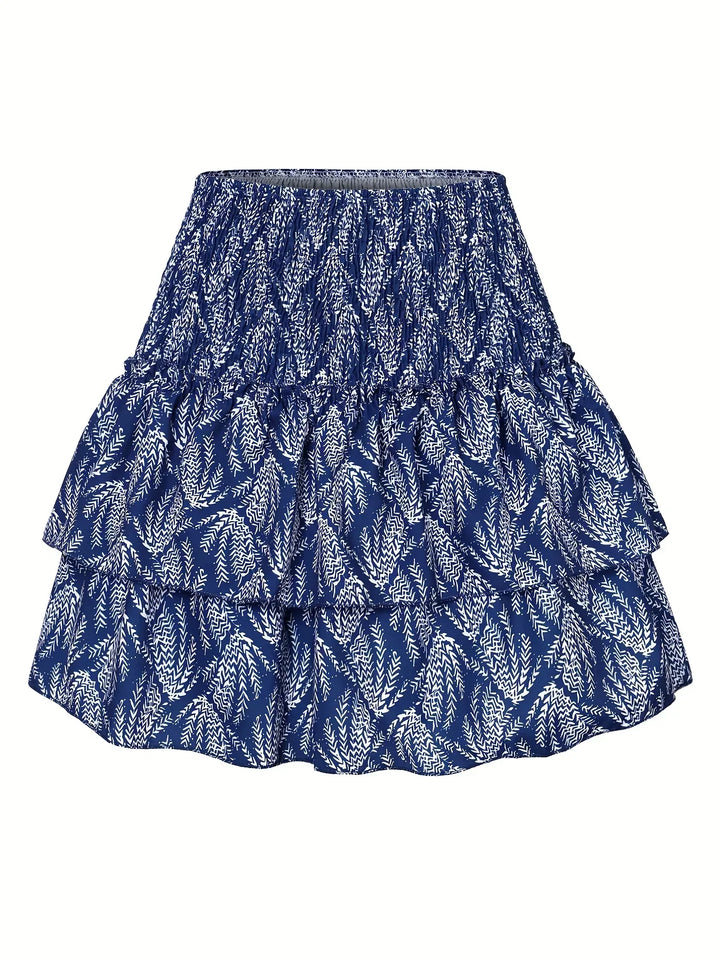 Flowy pleated midi skirt for women, with a chic layered hem, ideal for elegant and fashionable spring wear.