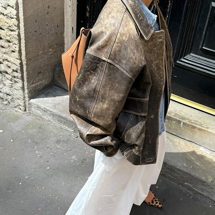Durable women's faux leather jacket in a vintage retro style, suitable for all seasons.