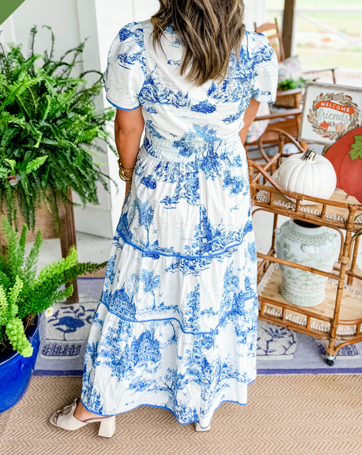 Feminine women's Felicity Classic Toile Maxi Dress, showcasing the elegant flowing tiered skirt and V-neck.