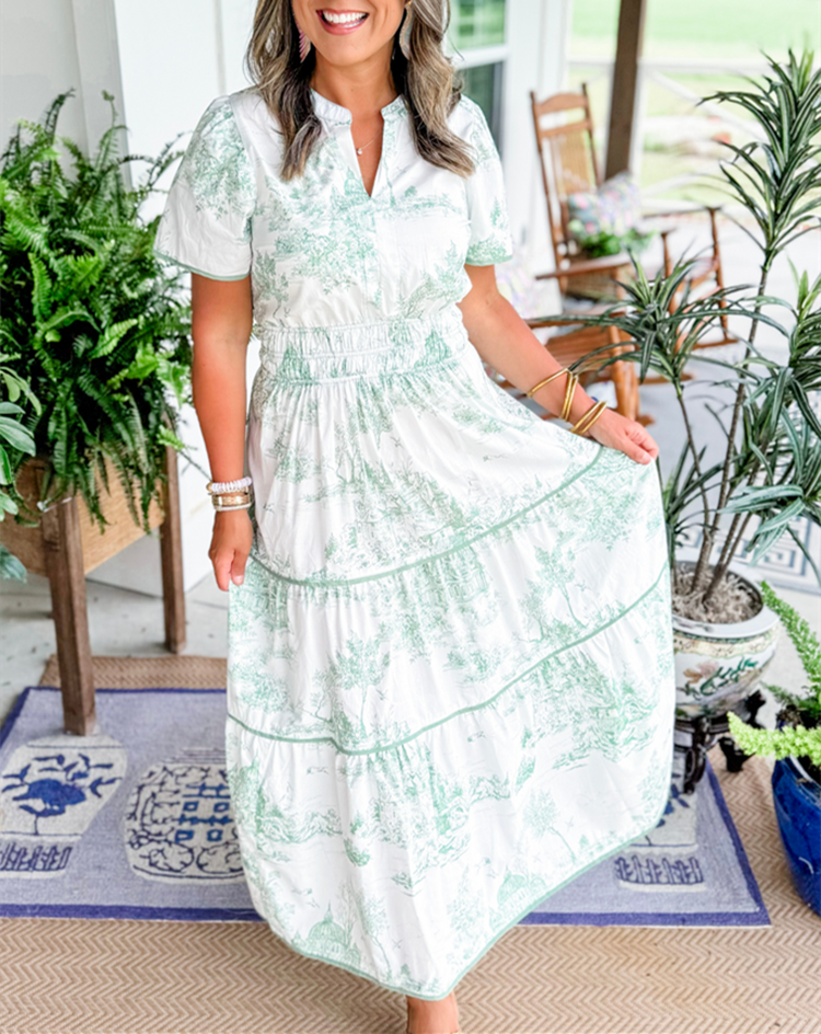 Classic women's toile print maxi dress, ideal for spring. Features a smocked waist, V-neck, and tiered skirt.