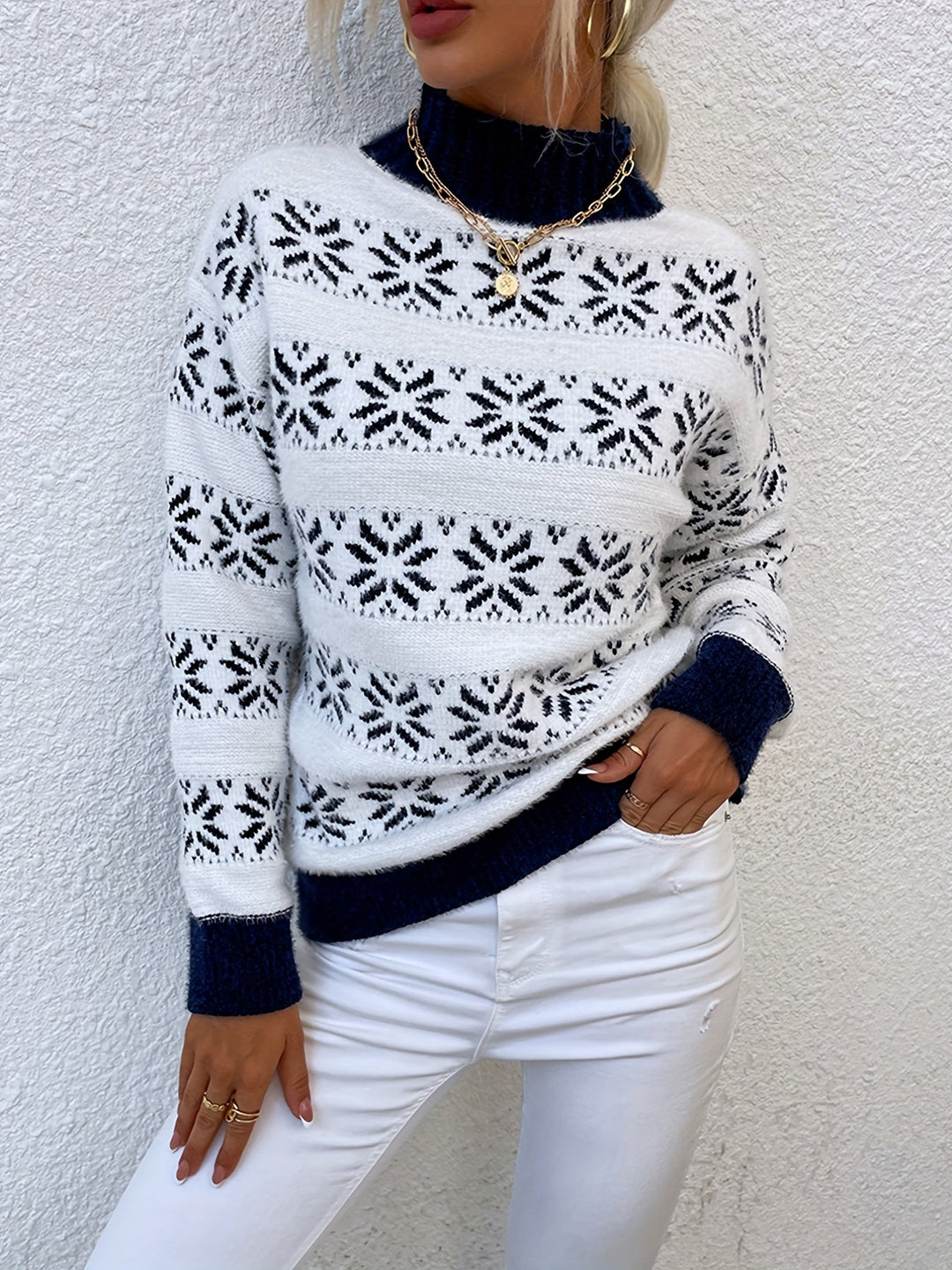 Women's mock neck festive Christmas sweater featuring a charming holly pattern. Ideal for holiday fashion.