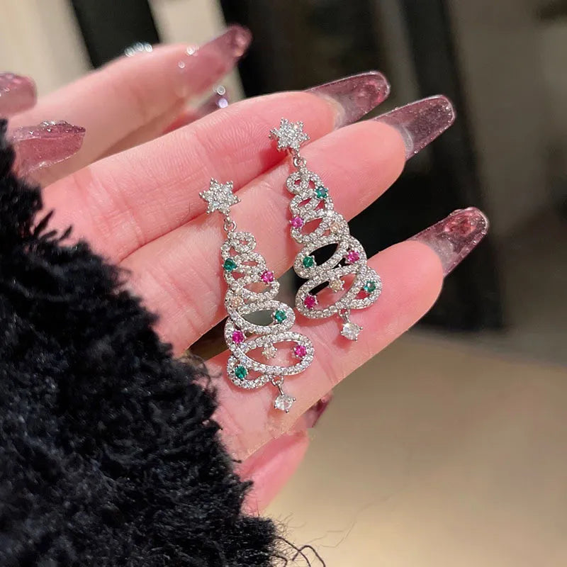 Women's festive Christmas tree tassel earrings, perfect holiday jewelry for seasonal celebrations.