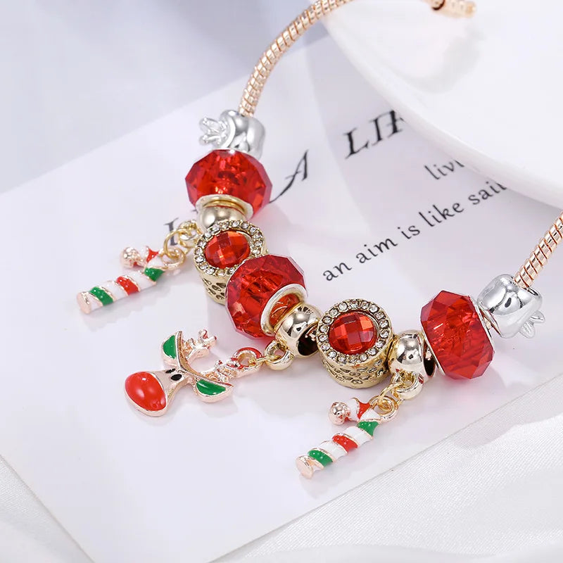 Elegant women's Christmas candy cane charm bracelet. Silver tone with festive red & white charms. Holiday jewelry.