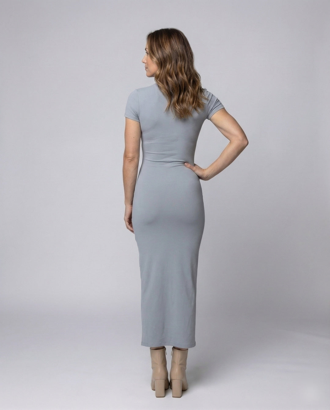 Sleek black women's bodycon maxi dress. Crew neck, short sleeve, form-fitting design for a sophisticated look.