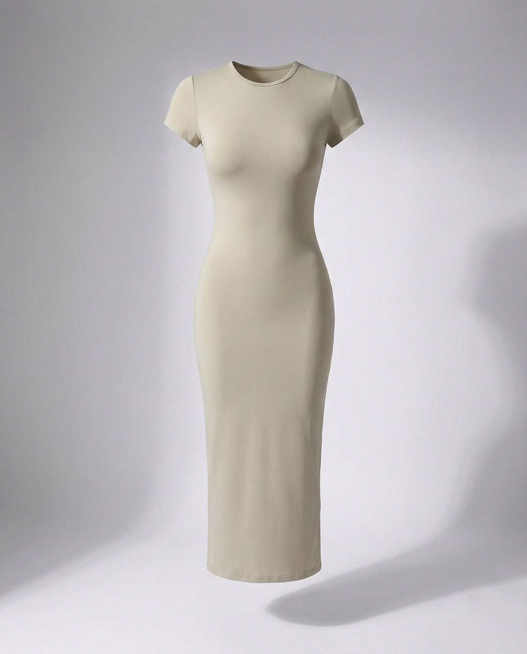Close-up of sleek fabric on a women's fitted bodycon maxi dress, highlighting texture and elegant drape.
