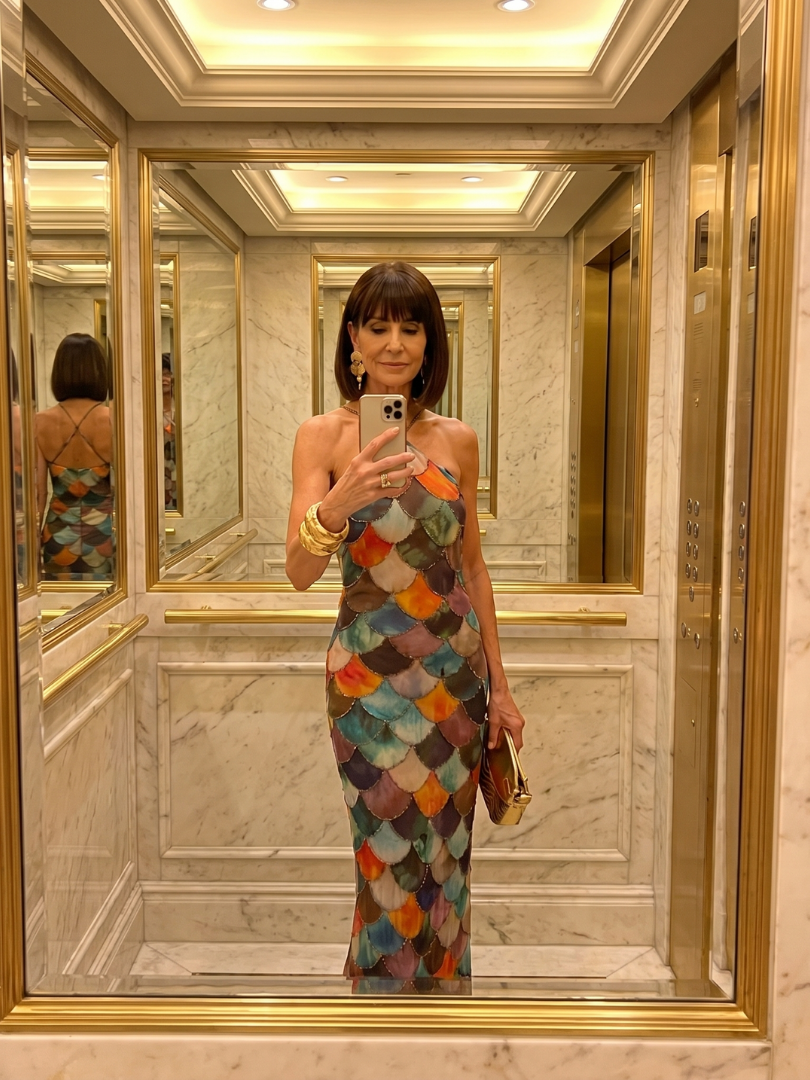 Fitted halter maxi dress for women, showcasing a modern bold geometric print. Elegant summer fashion.