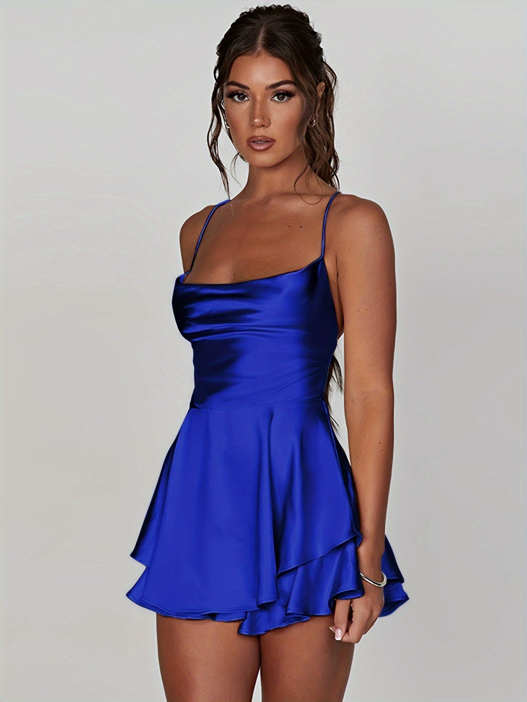 Stylish women's fitted ruched mini dress, featuring a charming tiered skirt.