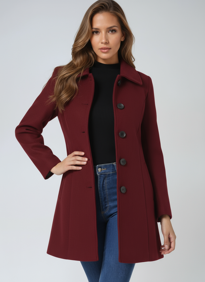 Full view of elegant women's fitted trenchcoat, classic long sleeve, button closure, professional workwear style.