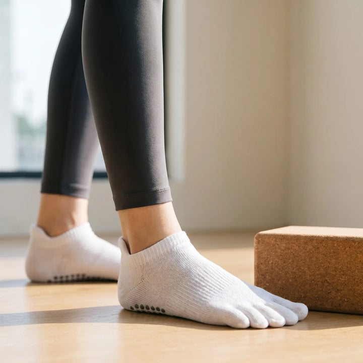 Women's five-toe grip yoga and pilates socks. Non-slip athletic studio socks for enhanced balance & stability during workouts.