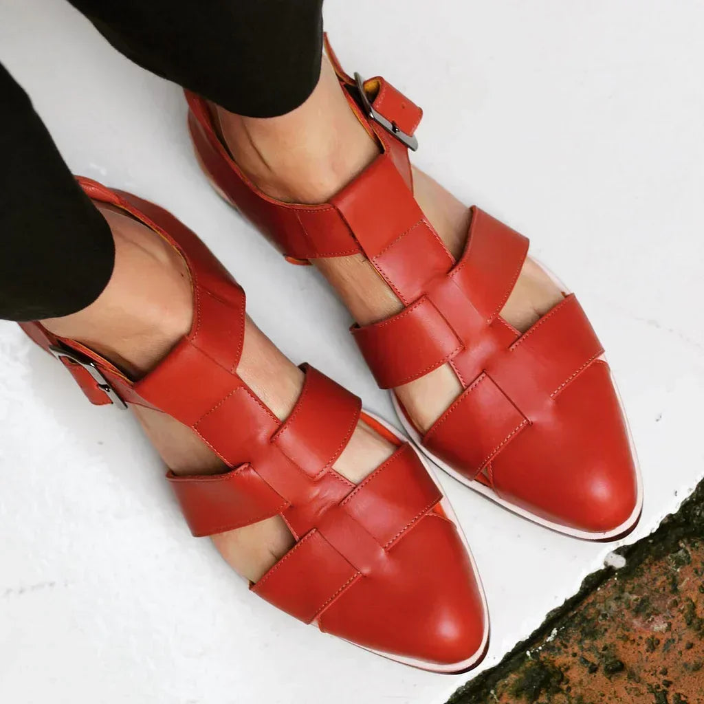 Women's flat sandals with intricate woven straps, perfect for casual daily wear and summer comfort.