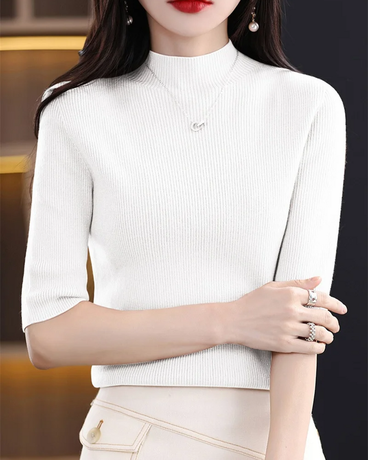 Comfortable women's ribbed knit long sleeve top, versatile for layering in any season.