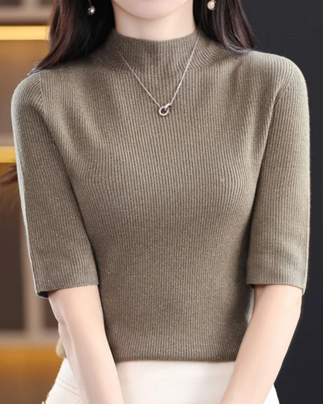 Simple yet elegant women's ribbed knit long sleeve top, flattering for daily wear.