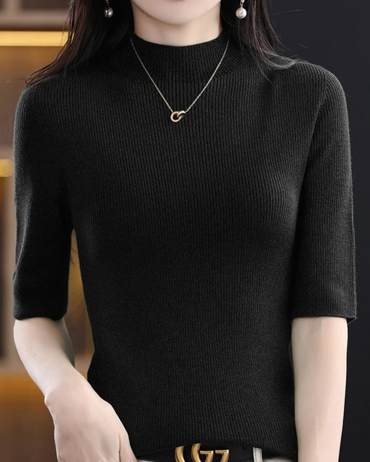 Modern women's long sleeve ribbed knit top, flattering fit for versatile everyday style.