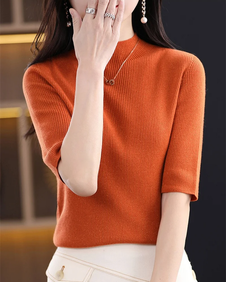 Soft ribbed knit long sleeve top for women, perfect for a chic and comfortable casual style.