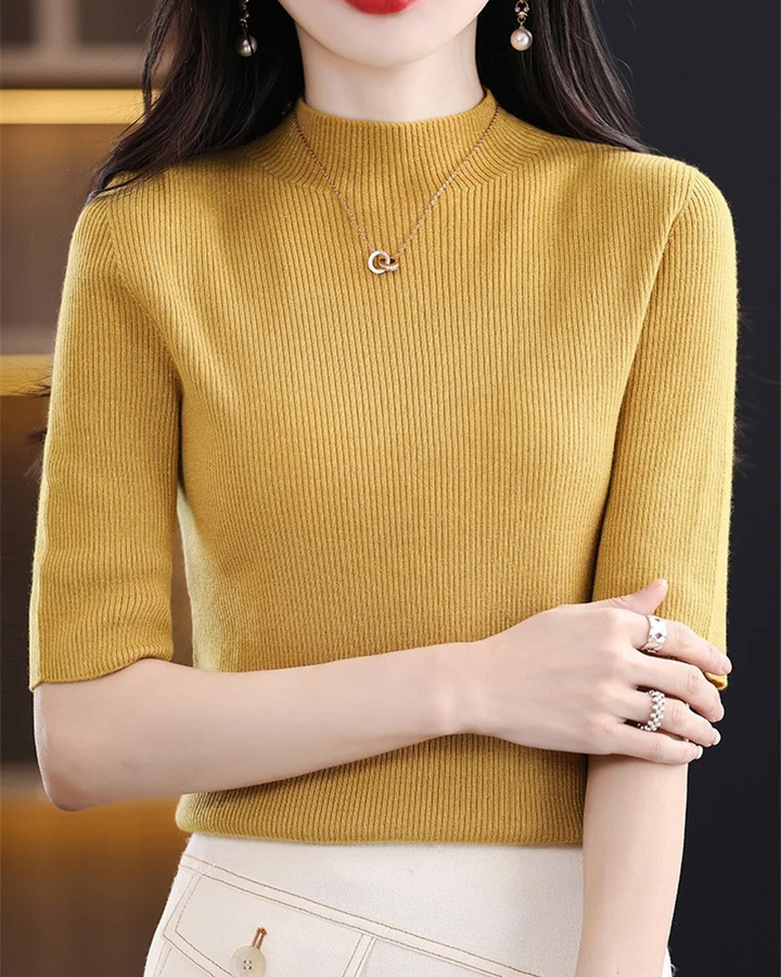 Elegant women's ribbed knit top, long sleeve, offering versatile style for any occasion.