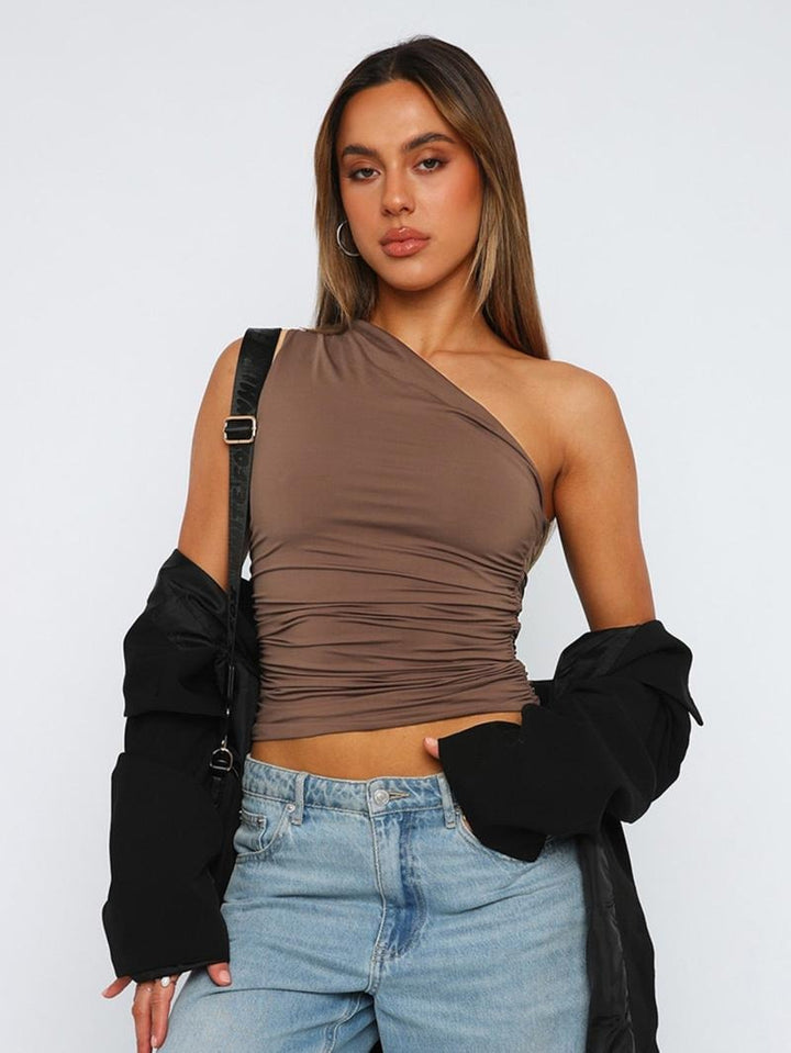 Pink cropped ruched one-shoulder top for women. Stylish, modern, perfect for casual or evening wear.