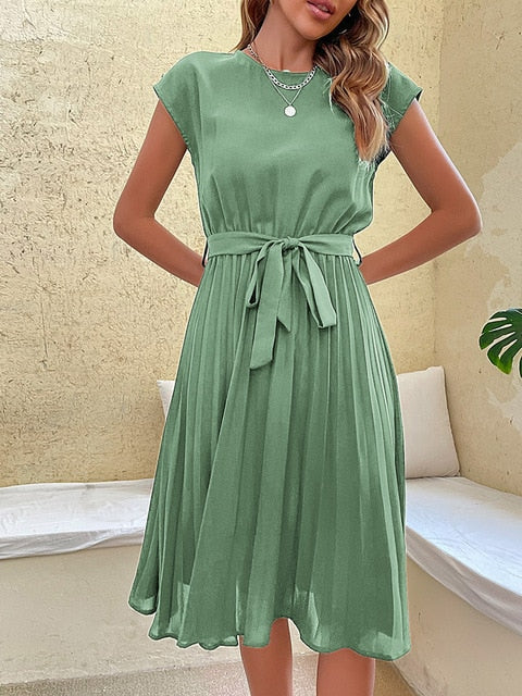 Elegant pleated midi summer dress for women. Versatile short sleeve design, perfect for casual or dressed up.