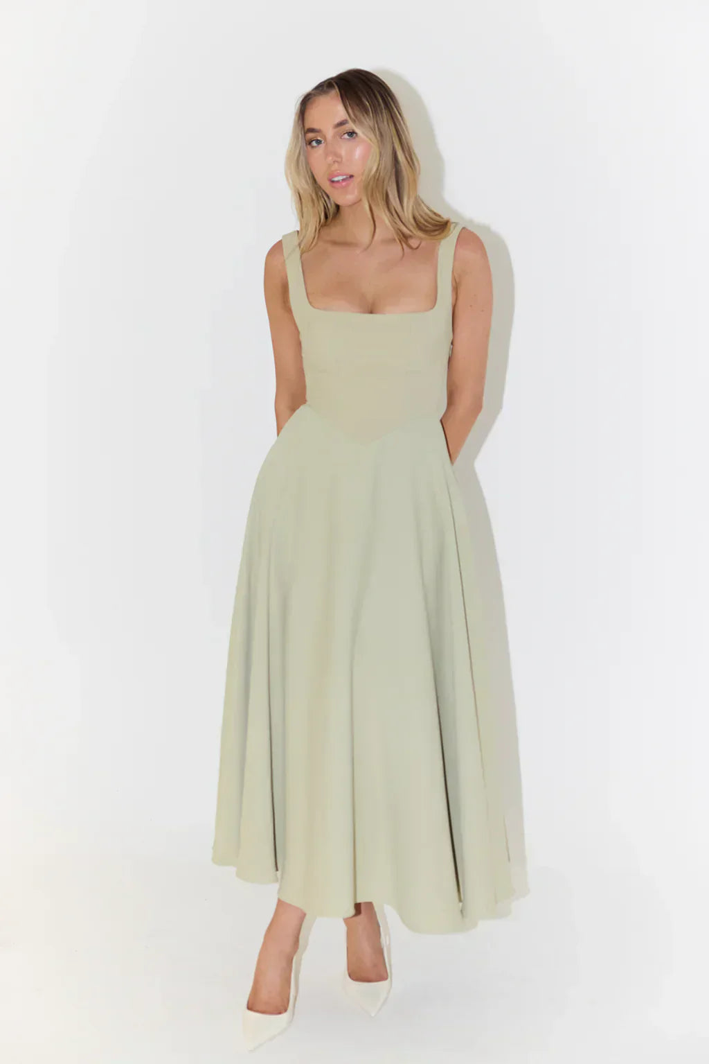Elegant sleeveless midi dress, versatile for day or evening special occasions.