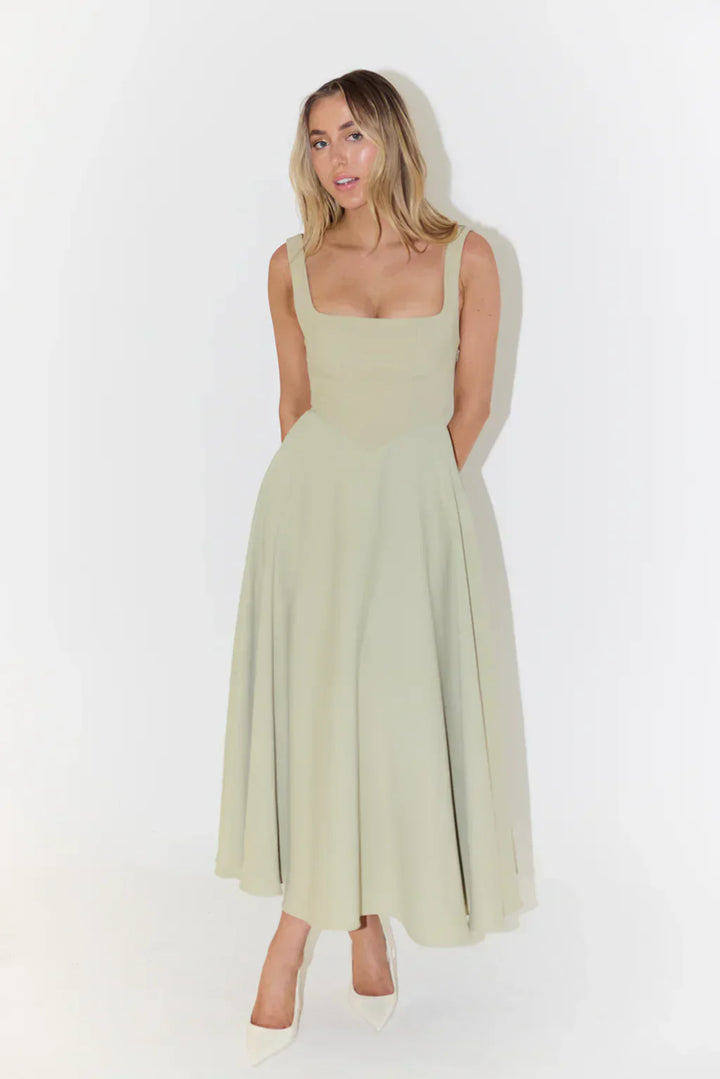 Elegant sleeveless midi dress, versatile for day or evening special occasions.