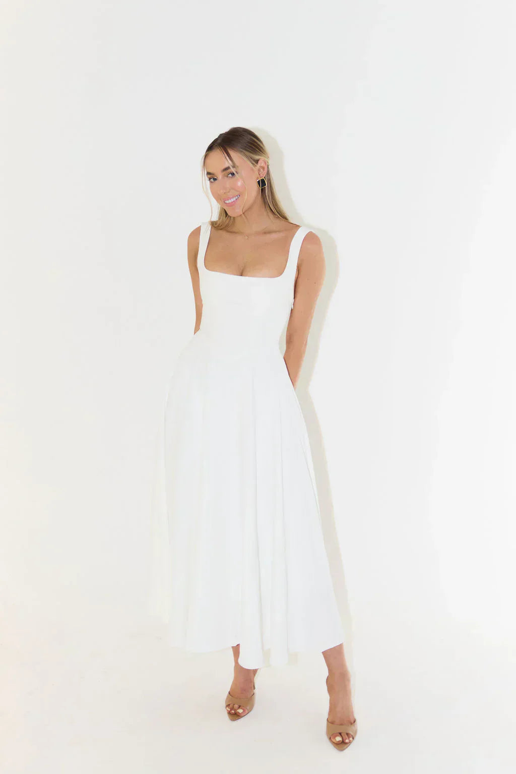 Summer-ready square neck midi dress, sleeveless and versatile for warm-weather style.
