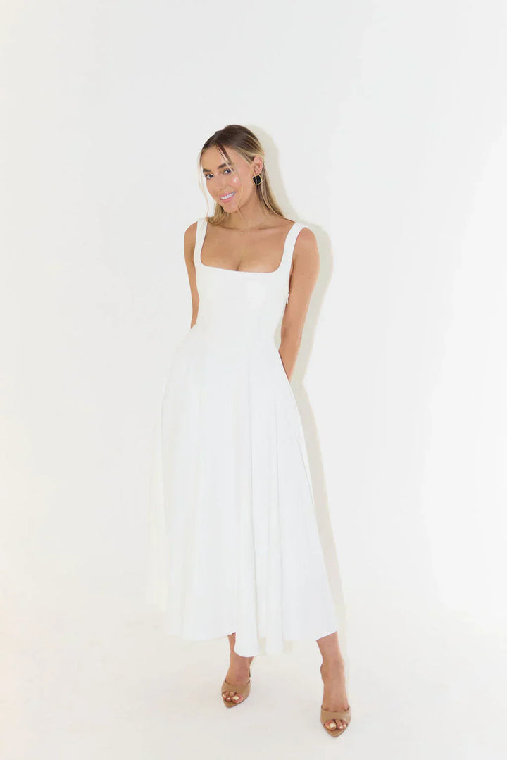 Summer-ready square neck midi dress, sleeveless and versatile for warm-weather style.