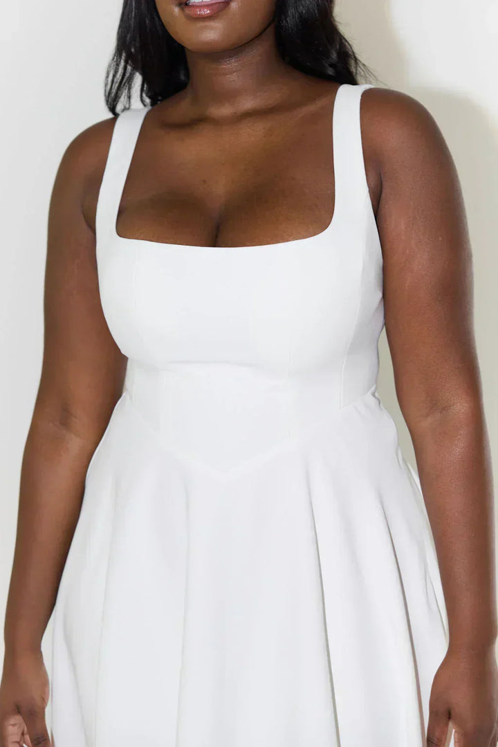 Sleeveless women's midi dress with a chic square neck, a flattering summer essential.