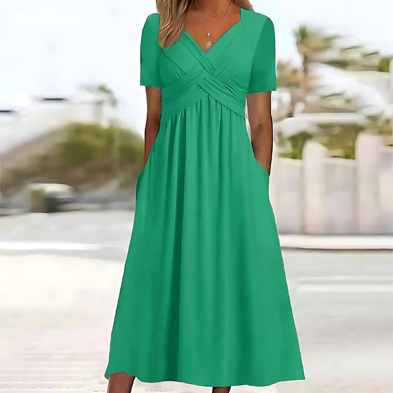 Women's flattering V-neck A-line midi dress with pockets, perfect for summer casual or elegant occasions.