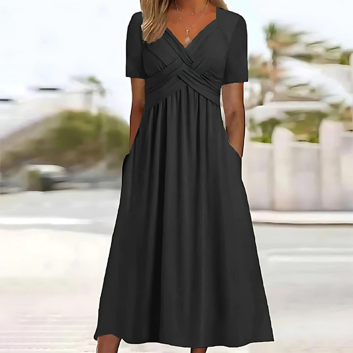 Elegant women's A-line midi dress with V-neck, flattering silhouette & practical pockets. Ideal for summer travel.
