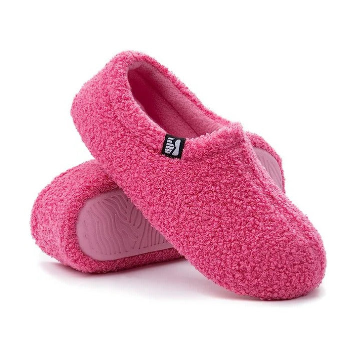 Cozy closed-back women's slippers ensure a secure fit for all-day indoor comfort.