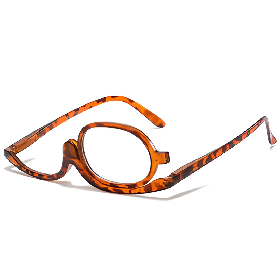 Close-up of women's flip-up reading glasses, designed for presbyopia & detailed makeup application.