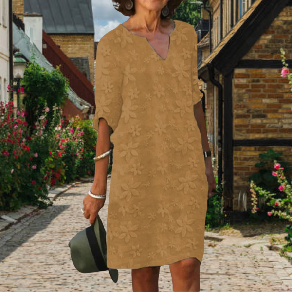 Stylish women's summer midi dress. Features floral appliqué, notch neck, & 3/4 sleeves. Everyday comfort.
