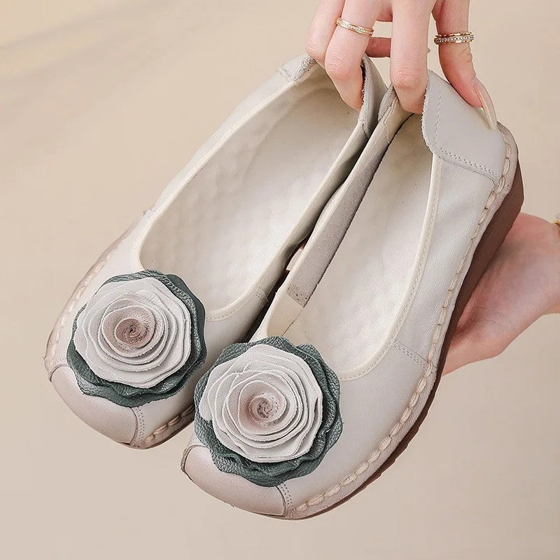 Women's floral appliqué slip-on loafers, perfect for comfortable everyday spring fashion.