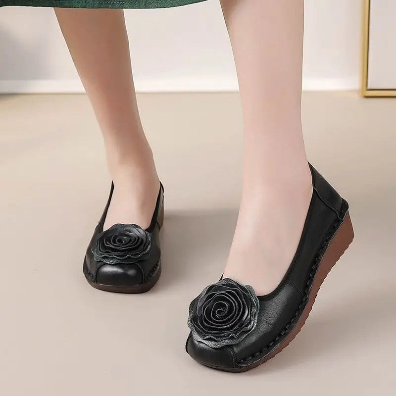 Everyday women's comfort loafers with stylish floral appliqué details and convenient slip-on style.