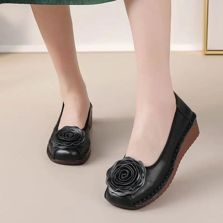 Everyday women's comfort loafers with stylish floral appliqué details and convenient slip-on style.